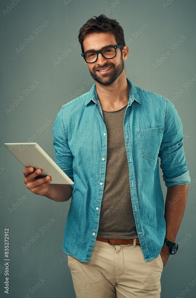 Poster Man, backdrop and portrait with tablet and glasses, career with software programming in London. Male creative, ebook and studio with happiness for digital job, mobile app or website development