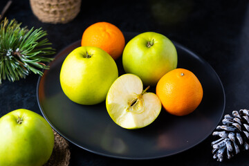 Fresh ripe green apples on wooden table against dark background, space for text