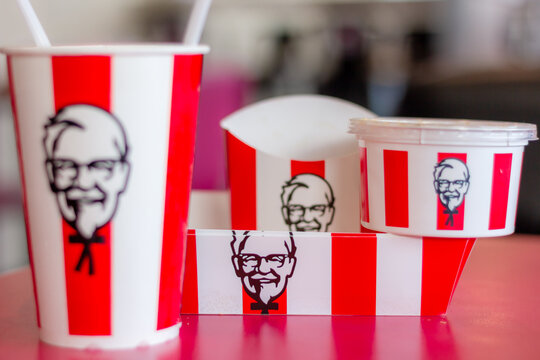 Cup of KFC's Pepsi, Cola, Soft drink with Chicken fried and Mashed potato in the blurred background of KFC store