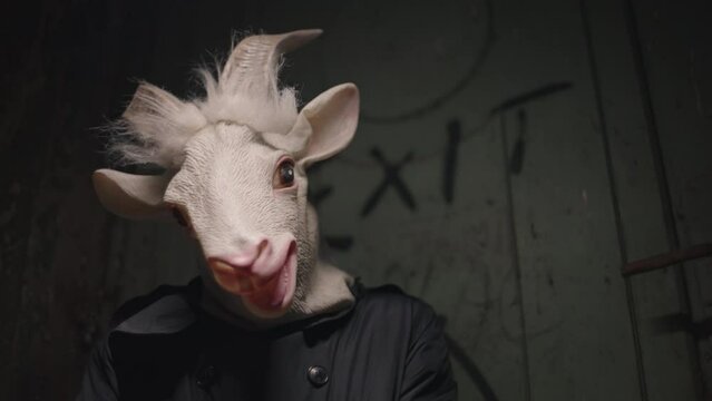 Scary horror scene with a weird, masked man.