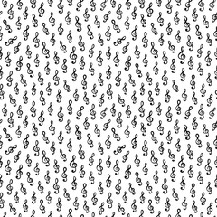 Treble clef music symbols on white background arranged in seamless pattern. Surface art texture in black and white for use in fabric or graphic design or printing on various surfaces.