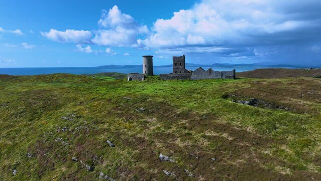 Ancient lighthouse on a green island in the middle of the Atlantic Ocean 
