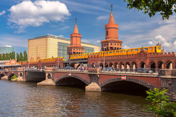 Old Berlin Oberbaum Bridge over the Spree River on a sunny day.