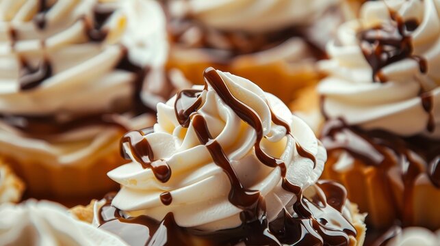 Close-up of delicious desserts featuring whipped cream and chocolate drizzle, highlighting the variety and richness of sweet treats. Perfect for food and culinary photography