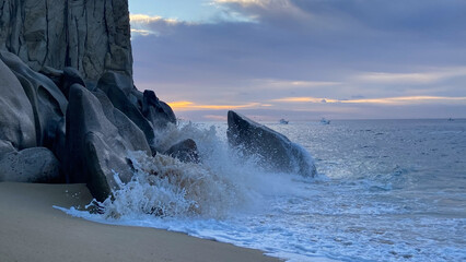 Colorful Sunrise Over Crashing Waves in the Ocean in Cabo San Lucas Mexico