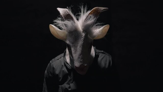 Creepy cultist in a dark room.