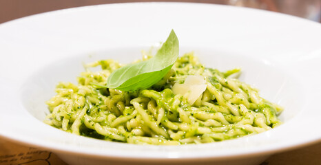 Traditional Italian food - trofie al pesto, typical regional pasta from Liguria region, basil sauce