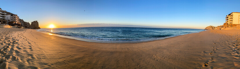 Sunrise Over the Beach and Rocks with Waves in Cabo San Lucas