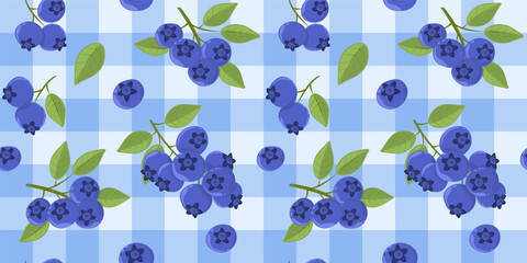 Seamless pattern with blueberry sprigs and green leaves on a blue checkered tablecloth