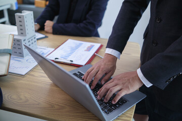 group of businessmen and investors discuss investing in real estate and jointly plan investments in construction projects of condominiums and apartments for sale and rent. investment advisory concept