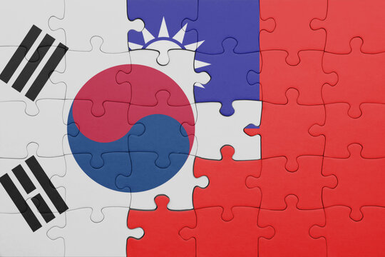 puzzle with the colourful national flag of taiwan and flag of south korea. - Powered by Adobe