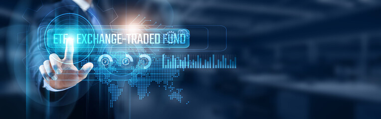 Businessman touching ETF digital screen showing network connection, data analysis and exchange-traded fund (ETF) management concept. Global financial markets.