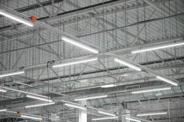  Empty factory interior or storehouse.  Warehouse roof with lighting equipment