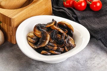 Roasted champignon mushrooms in the bowl