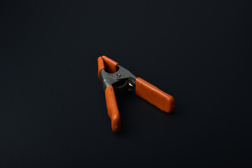 old partially rusted clamp on a black background