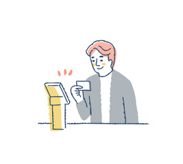 セルフオーダーシステムでカード決済する男性