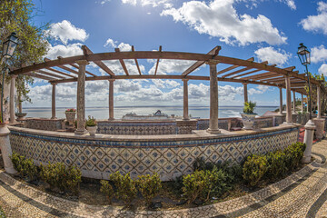 Miradouro de Santa Luzia, a beautiful viewpoint in Lisbon, offering a wide view panoramas of the historic Alfama district and the Tagus River. Lisbon, Portugal