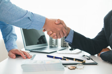 Real estate brokers offer attractive promotions customers so they can decide purchase condominium unit for living and as value added asset. Concept of signing real estate purchase contract with dealer