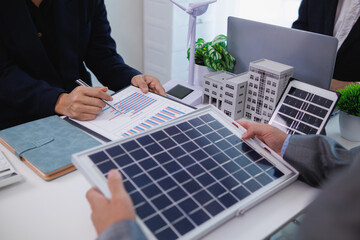 architects and investors discuss real estate projects using clean energy or solar cells within...