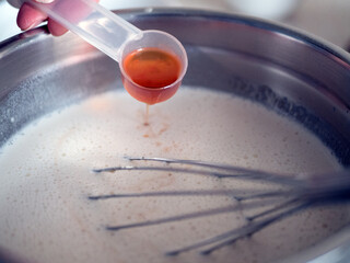 Adding rum or another flavor to batter to prepare tasty and fragrant pastries. Cooking process