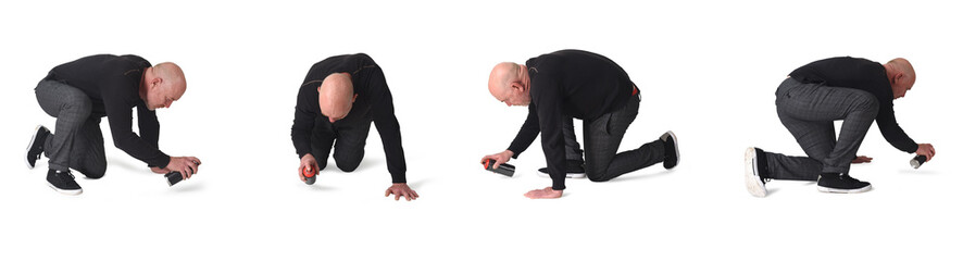 various poses of same man painting on the floor with spray on white background
