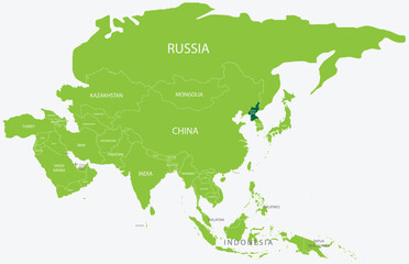 Highlighted green map of NORTH KOREA inside light green political map of Asia using orthographic projection on light blue background