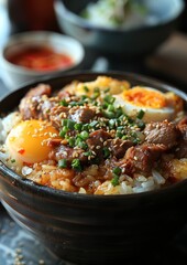 Fototapeta premium Donburi - Rice bowl topped with beef (gyudon), chicken (oyakodon), or seafood. 