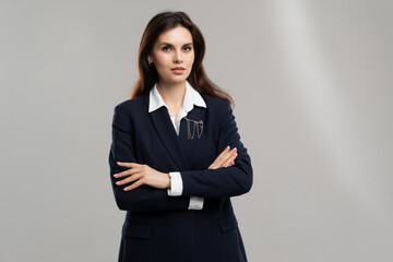Confident businesswoman in formal attire striking a pose © CinemaF