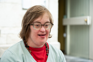 Expressive portrait of a 41 yo woman with the Down Syndrome, Tienen, Flanders, Belgium