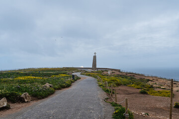 Coastline of Portugal, Cabo da Roca. Cape Roca in Sintra. The lighthouse in Cabo da Roca. Cliffs and rocks on the Atlantic ocean coast. Cloud day