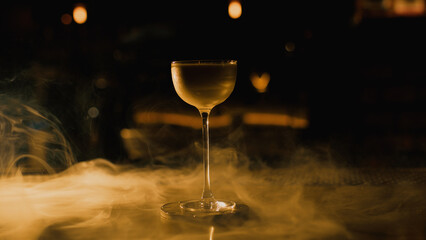 Elegant cocktail on bar with smoke