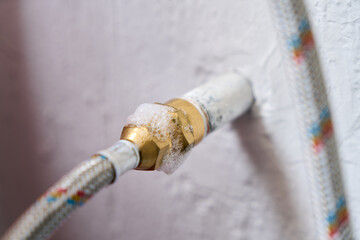 Gas pipe with soap mixture showing bubbles from gas leak