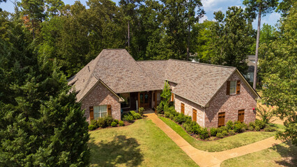 Obraz premium Suburban house with newly installed shingles