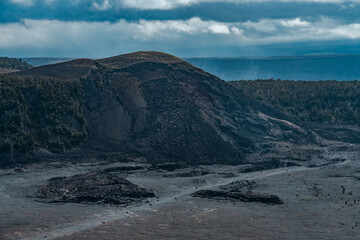 Kīlauea Iki is a pit crater that is next to the main summit caldera of Kīlauea on the island of Hawaiʻi in the Hawaiian Islands.   Pu'u Pua'i cinder cone .  Hawaii Volcanoes National Park, Kilauea 