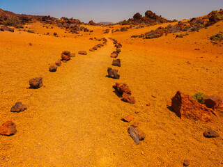 spot in Tenerife with many red rocks and beautiful mountain landscape background