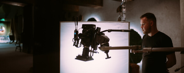 Director of photography with a camera in his hands on the set.