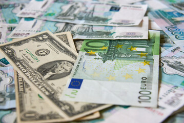 background of paper bills dollars, euros and rubles. Currency exchange rate
