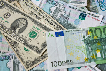 background of paper bills dollars, euros and rubles. Currency exchange rate