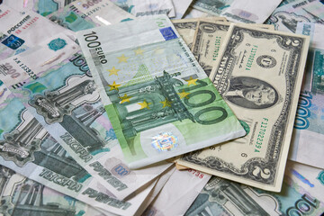 background of paper bills dollars, euros and rubles. Currency exchange rate