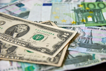 background of paper bills dollars, euros and rubles. Currency exchange rate
