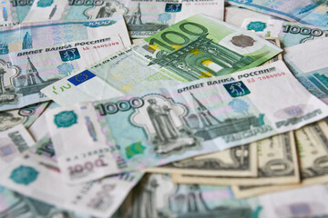 background of paper bills dollars, euros and rubles. Currency exchange rate