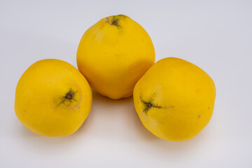 Group of ripe yellow quince apples close up