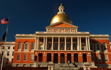 The gold dome of the Massachusetts State House in Boston shine over the seat of the State...