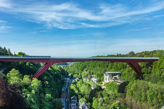 Grand Duchess Charlotte Bridge or Red Bridge (Pont Grande-duchesse Charlotte, 1966, German architect Egon Jux) above the old quarter neighborhood of Clausen. Luxembourg City. MAY 11, 2024.