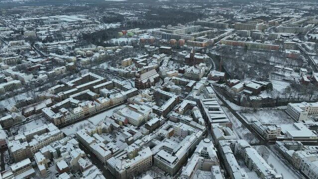 Drone shot of Cottbus covered in snow.