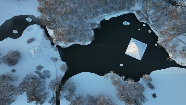 Zoom out drone shot of a pond in Cottbus.