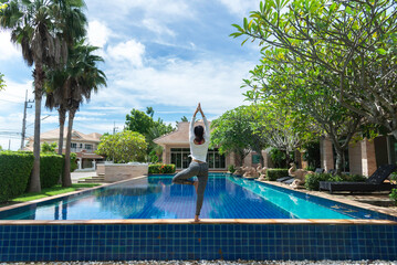 Young healthy woman practicing yoga Calmness and relax, female happiness.Horizontal background