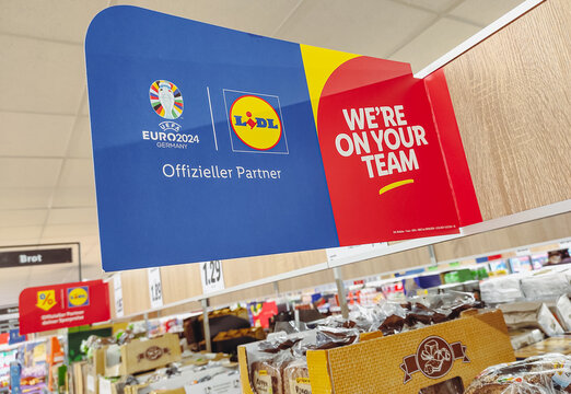 Advertising banner "Lidl - Official partner of the UEFA EURO 2024 in Germany". Seen at the Lidl store on Maybachufer street in Berlin