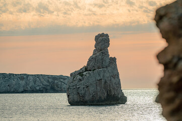 Sunset on Benirras beach in Ibiza in summer.
