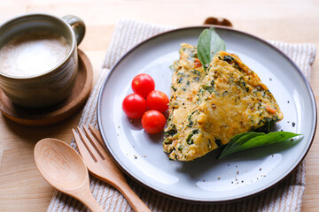 Delicious healthy homemade frittata with coffee for breakfast.